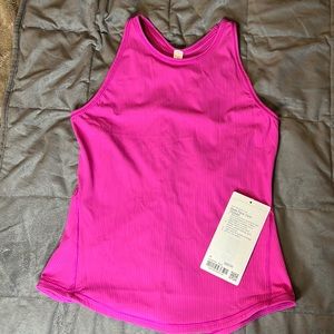 LULULEMON PURPLE HIGHLIGHT BASE PACE TANK. BRAND NEW. tag still attached.